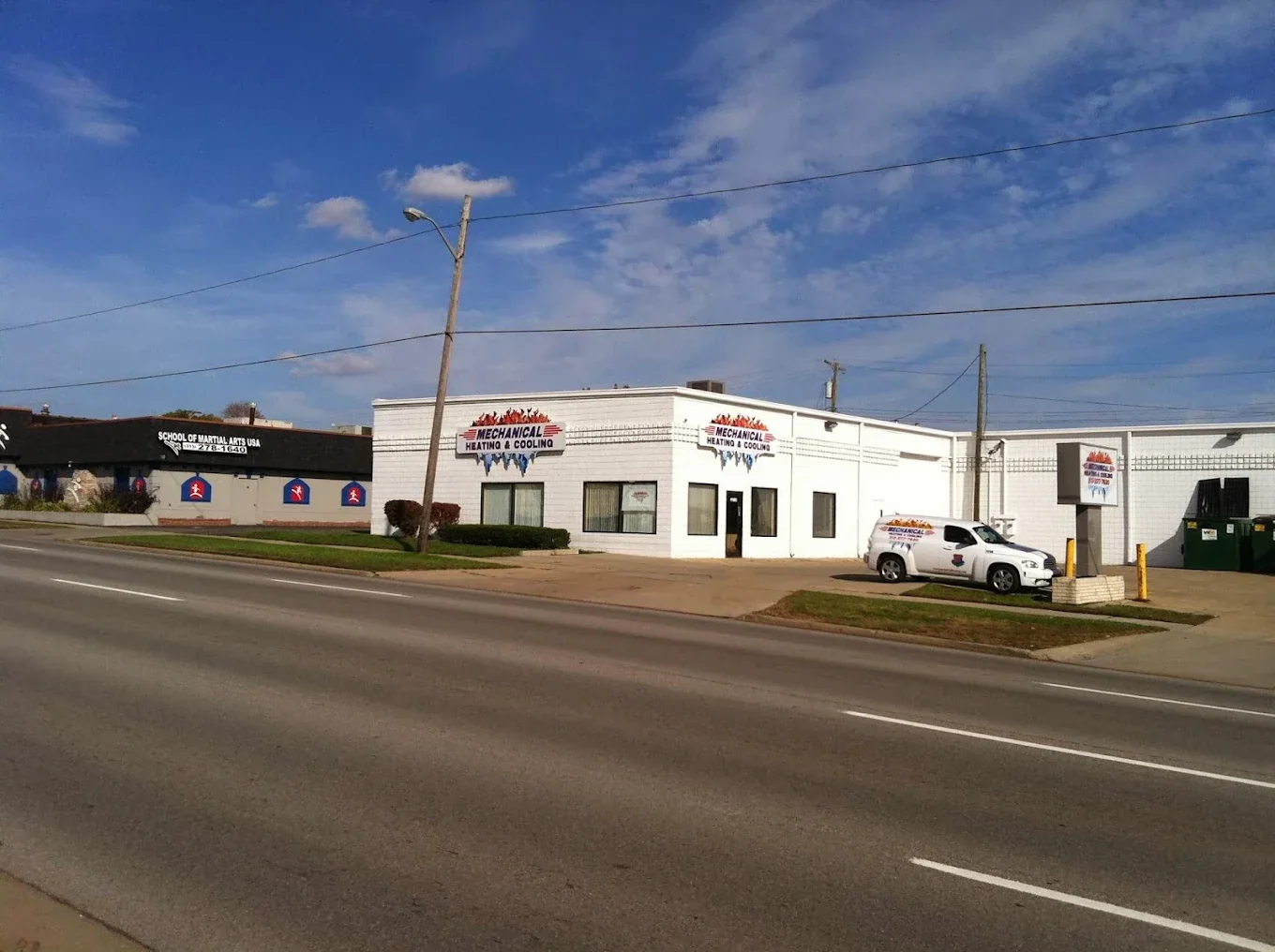 Mechanical Heating, Cooling & Electrical storefront exterior with the main building signage