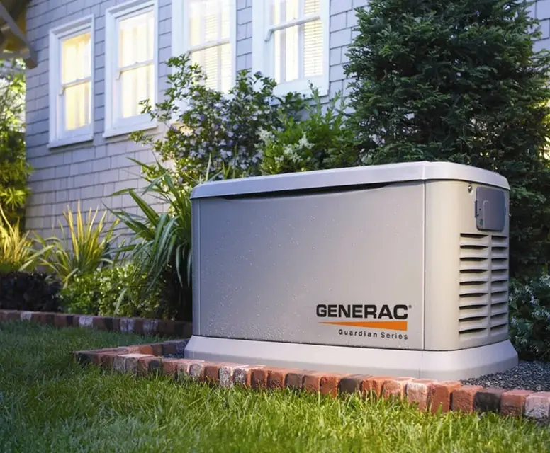 Backup generator installation by Generac in a landscaped garden setting, showcasing a reliable power solution for Garden City homes during outages.